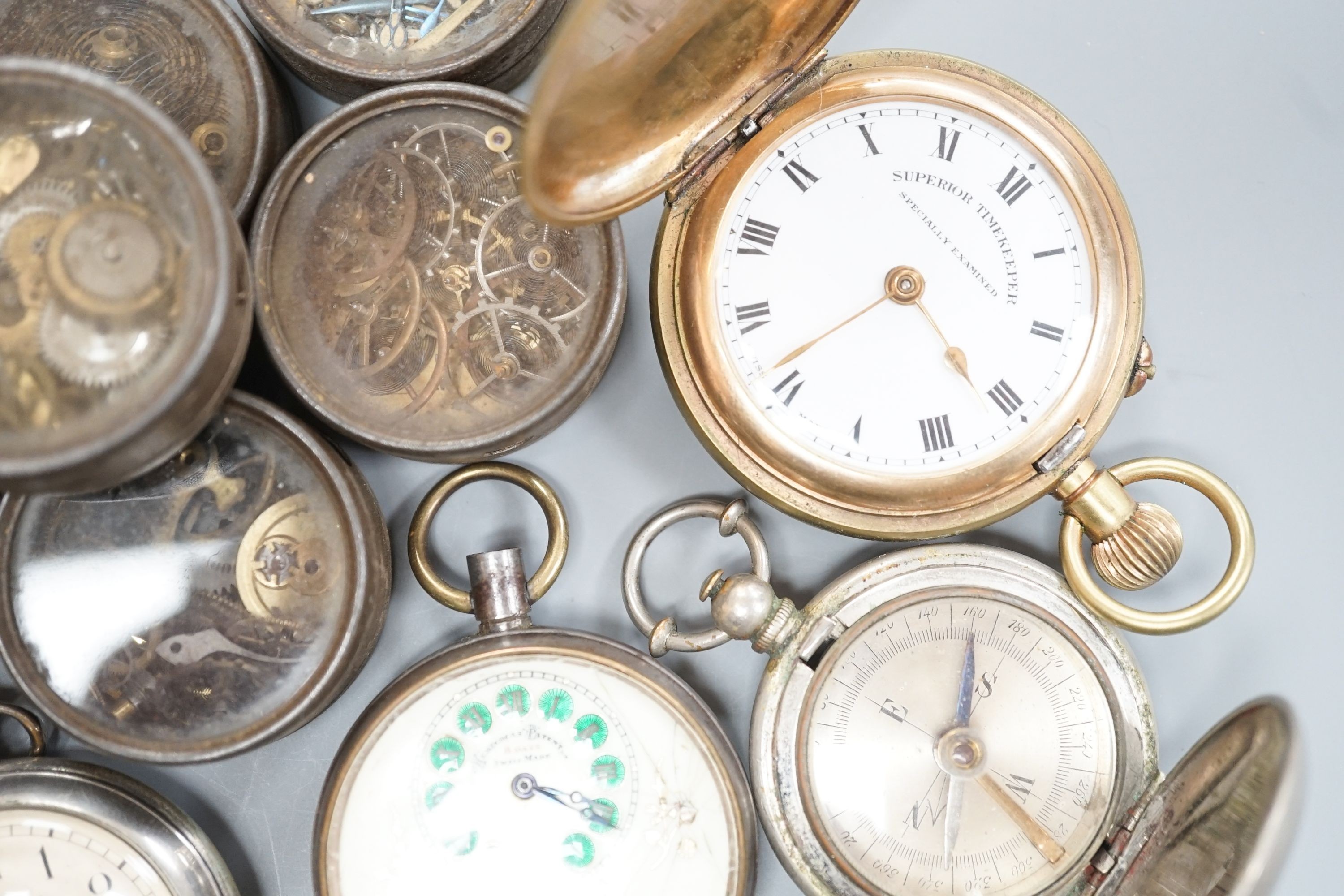 A small collection of assorted base metal and gold plated pocket watches including Hebdomas and Waltham and a small quantity of watch parts.